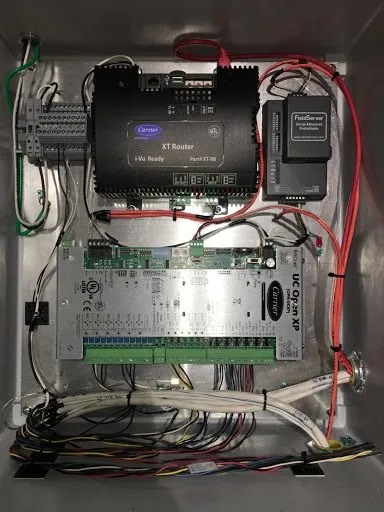 a box filled with lots of wires and electronics .