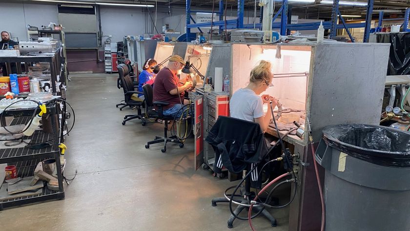 A group of people are working in a factory.