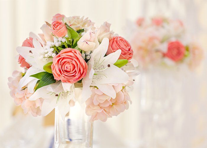 Holiday Parties  — Decorated Table With Floral In Vases In Pink And Coral Shades In Redford, MI