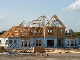 A large house is being built in a residential area