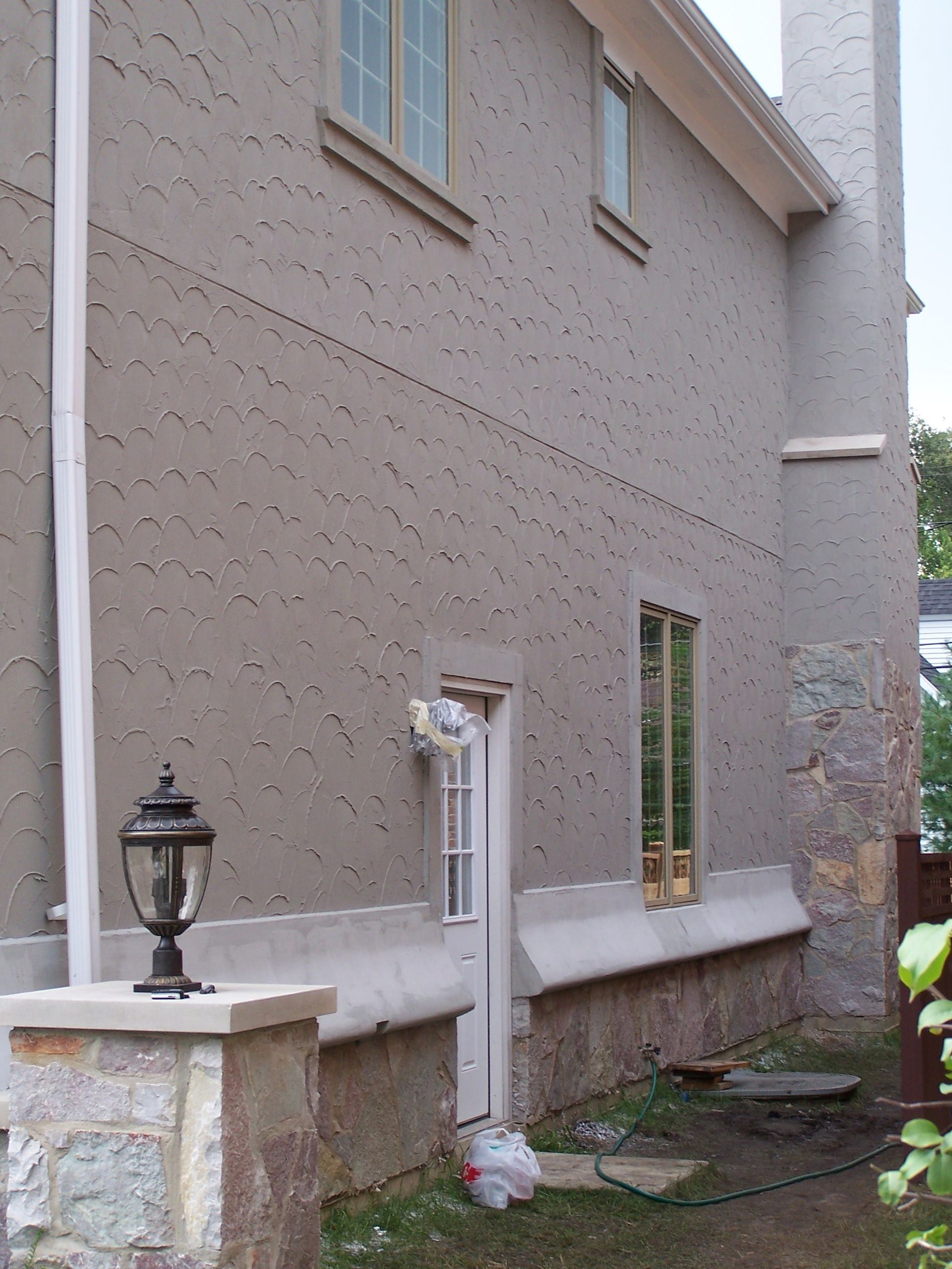A house with a lantern in front of it