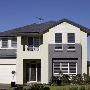 A house with a roof that has a bird on it