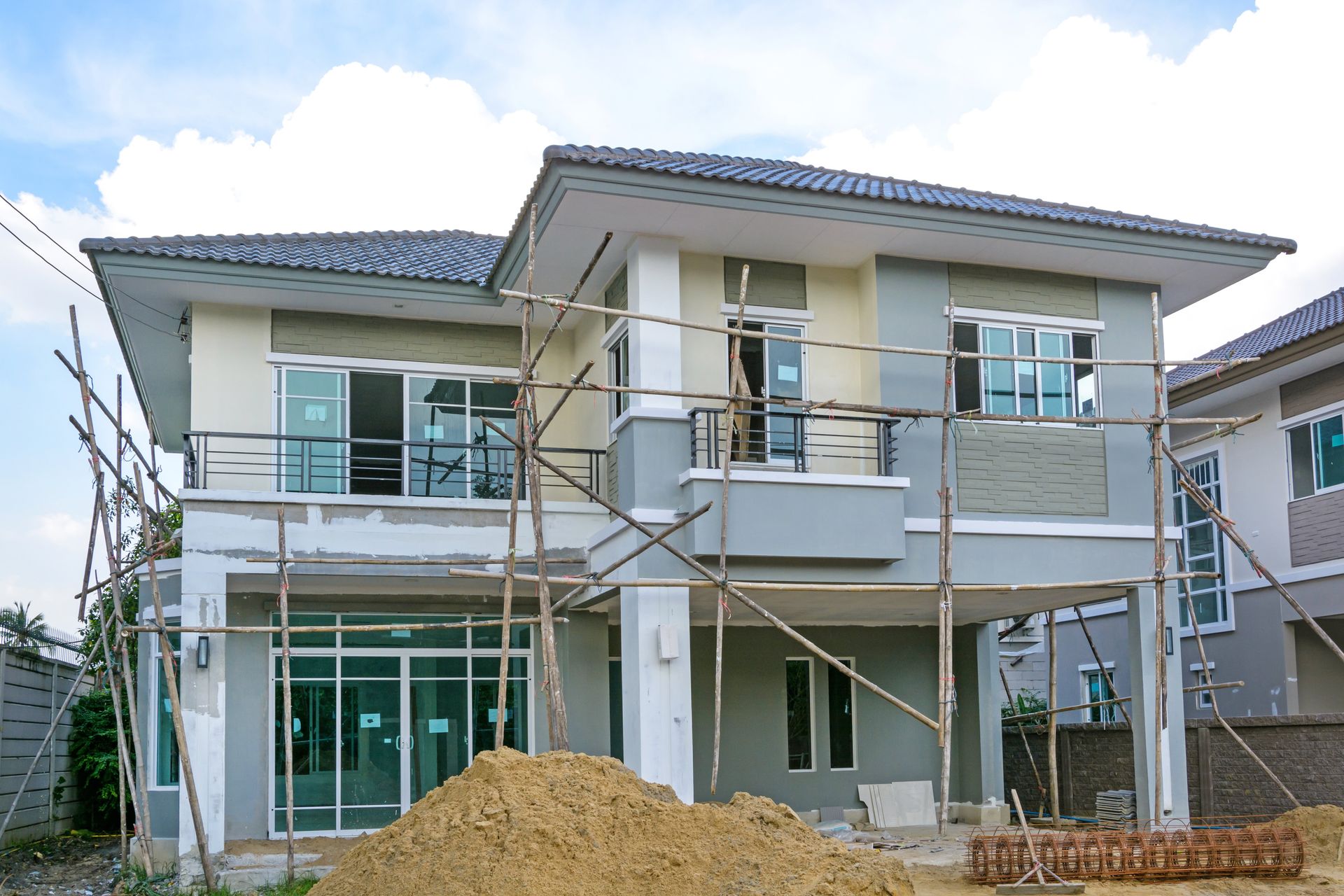 A house is being built with scaffolding around it.