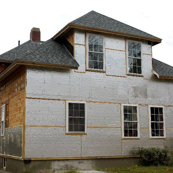 A house with a roof and a lot of windows