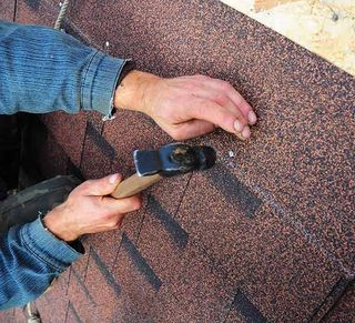 Roofer reinstalls roof shingles — Roofing Repairs in College Place, WA Roofer reinstalls roof shingles — Roofing Repairs in College Place, WA