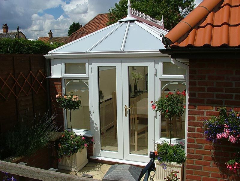 Conservatory Built Between Home and Privacy Wall in Norfolk
