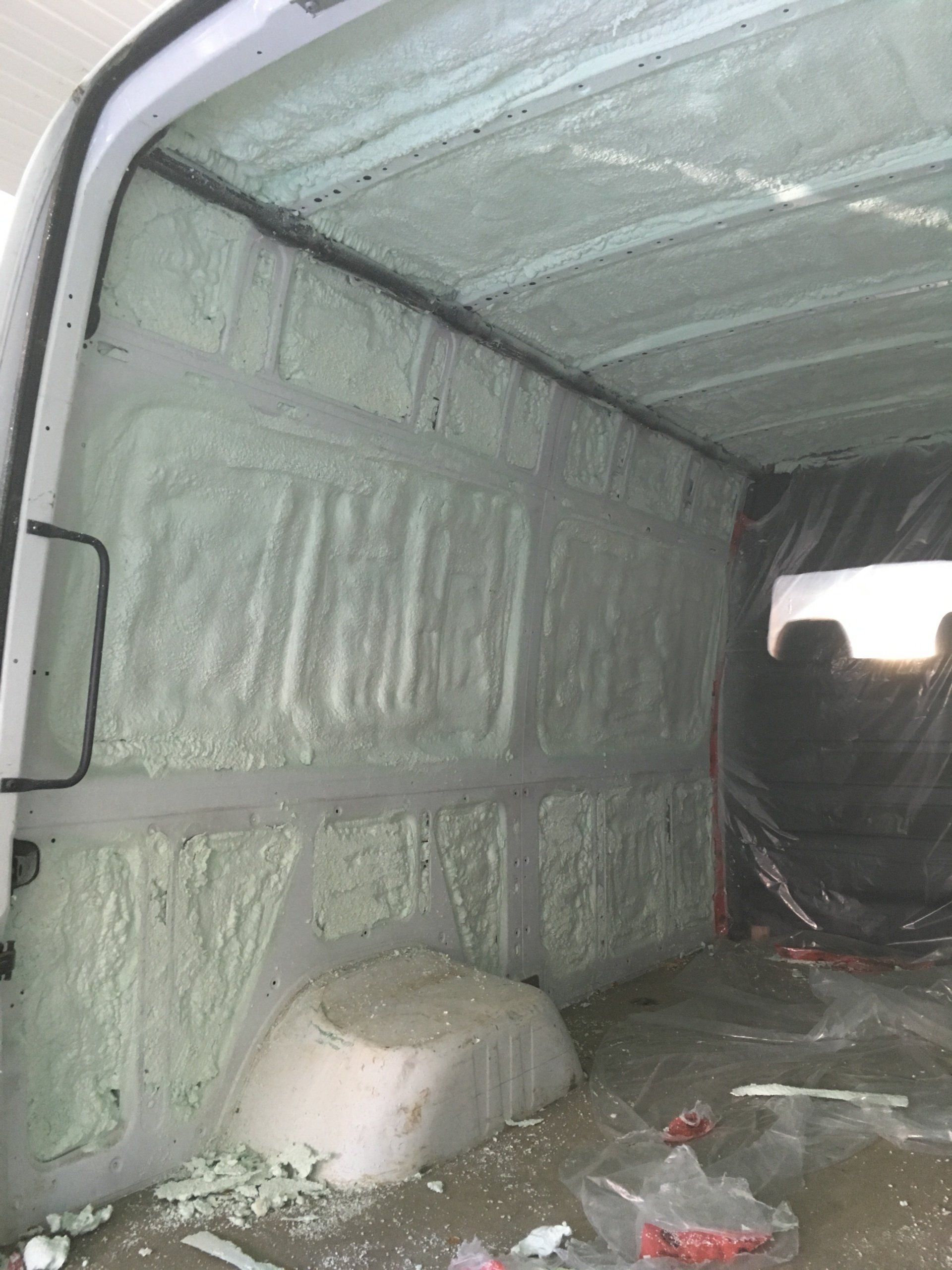 The inside of a van is covered in foam.