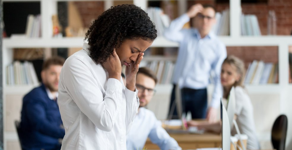 ad african female young employee packing belongings in box at workplace got fired from job