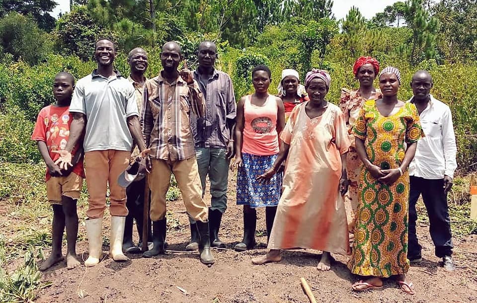 Farmers standing in their garden in Uganda