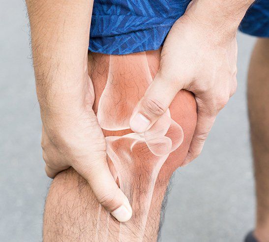 Man Holding His Knee — Bethlehem, PA — Salib Oncology Man Holding His Knee — Bethlehem, PA — Salib Oncology