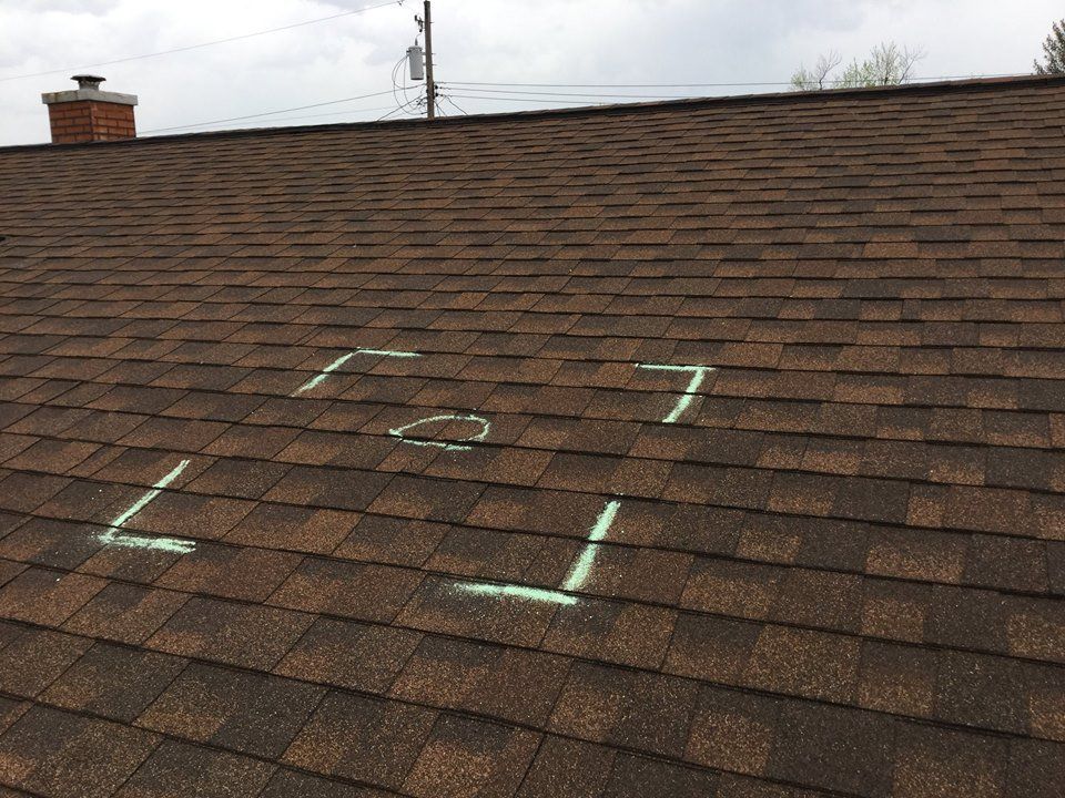 A roof with the letters l and t written on it