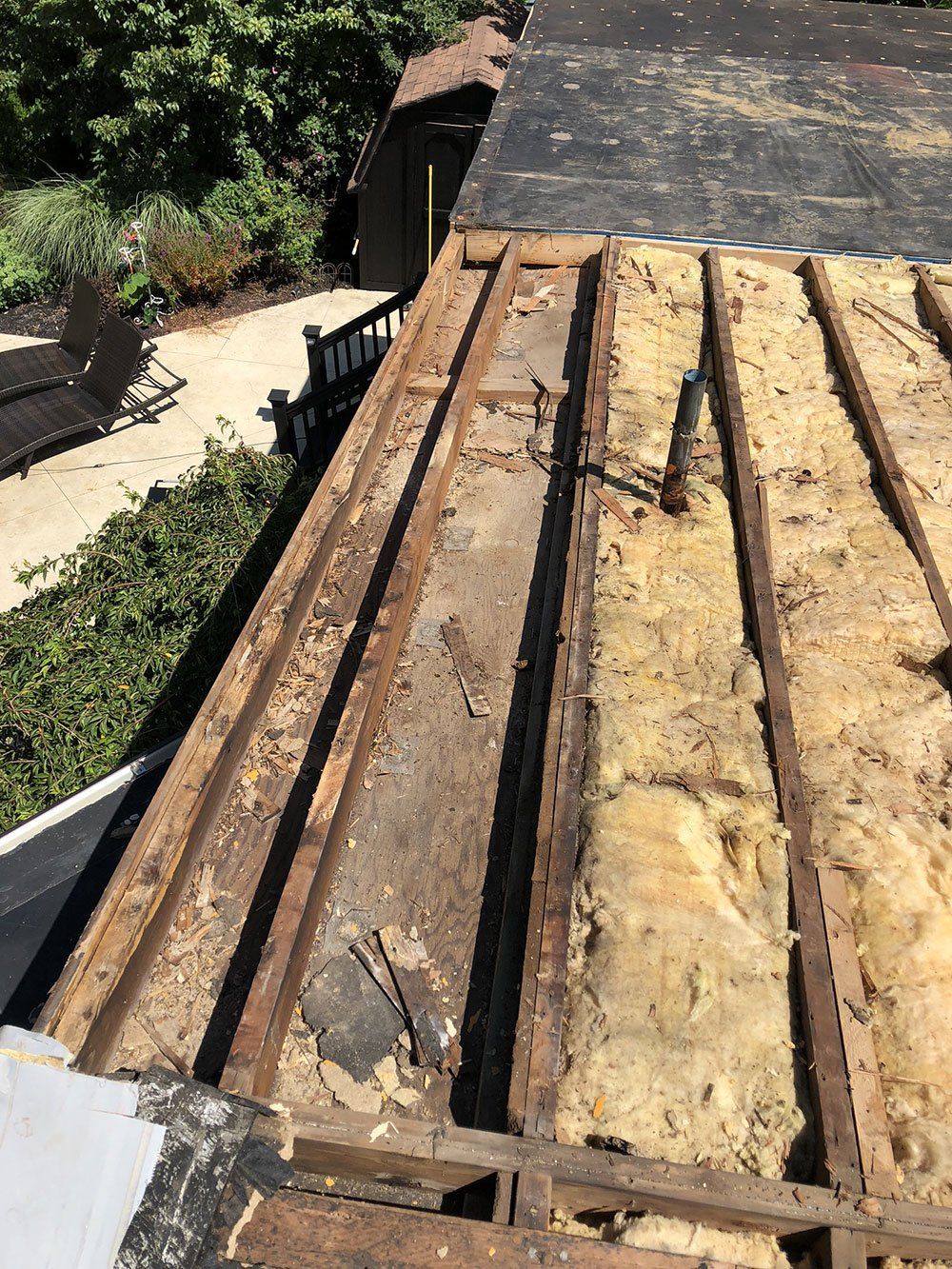 The roof of a house is being removed to make way for a new roof.
