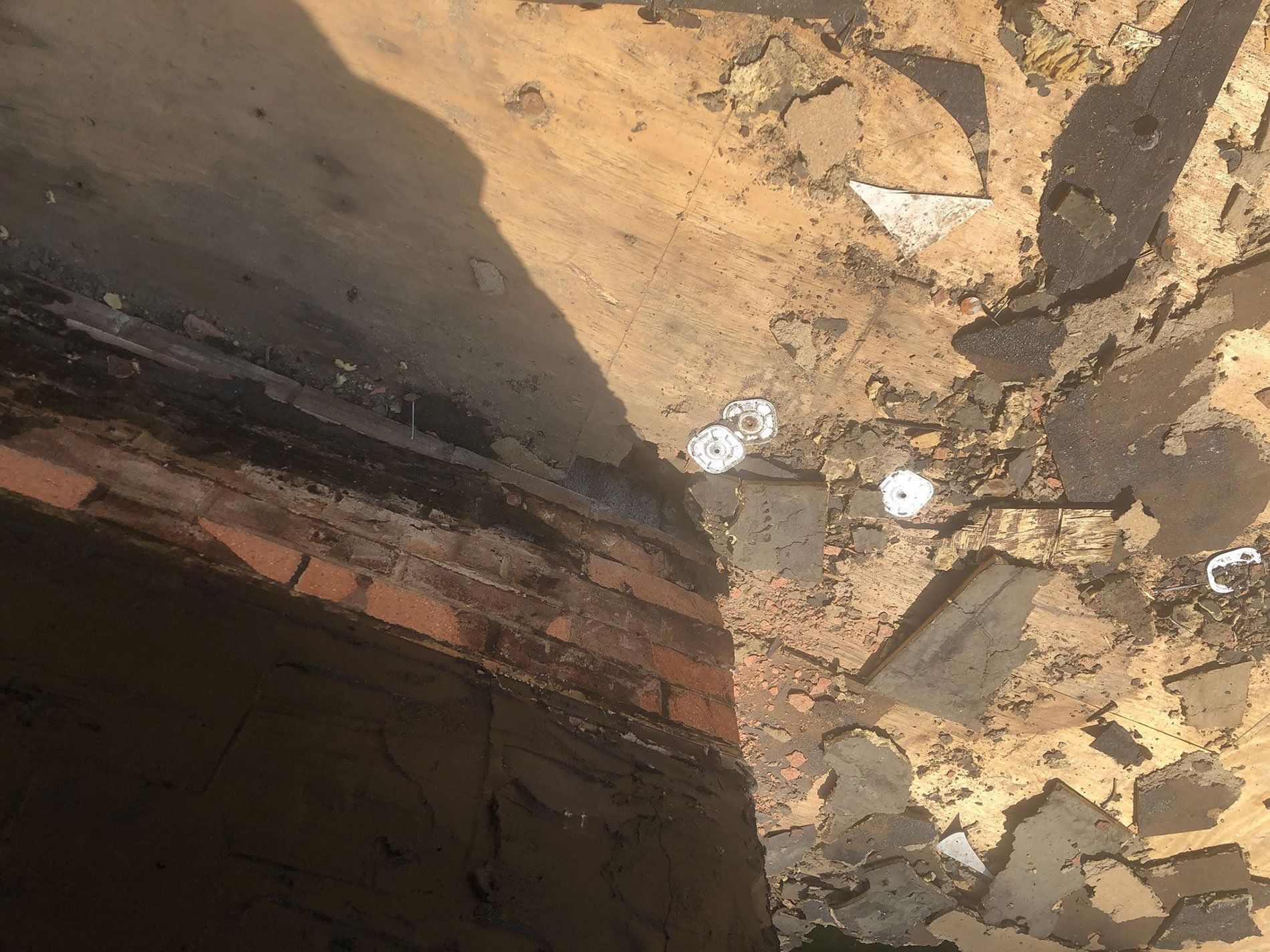 A close up of a brick wall with a hole in it