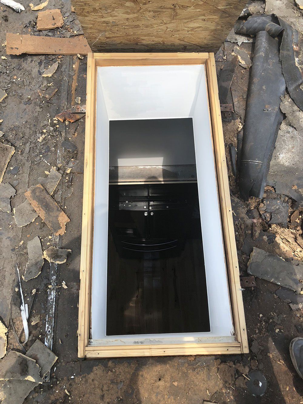 A wooden box with a hole in the middle of it