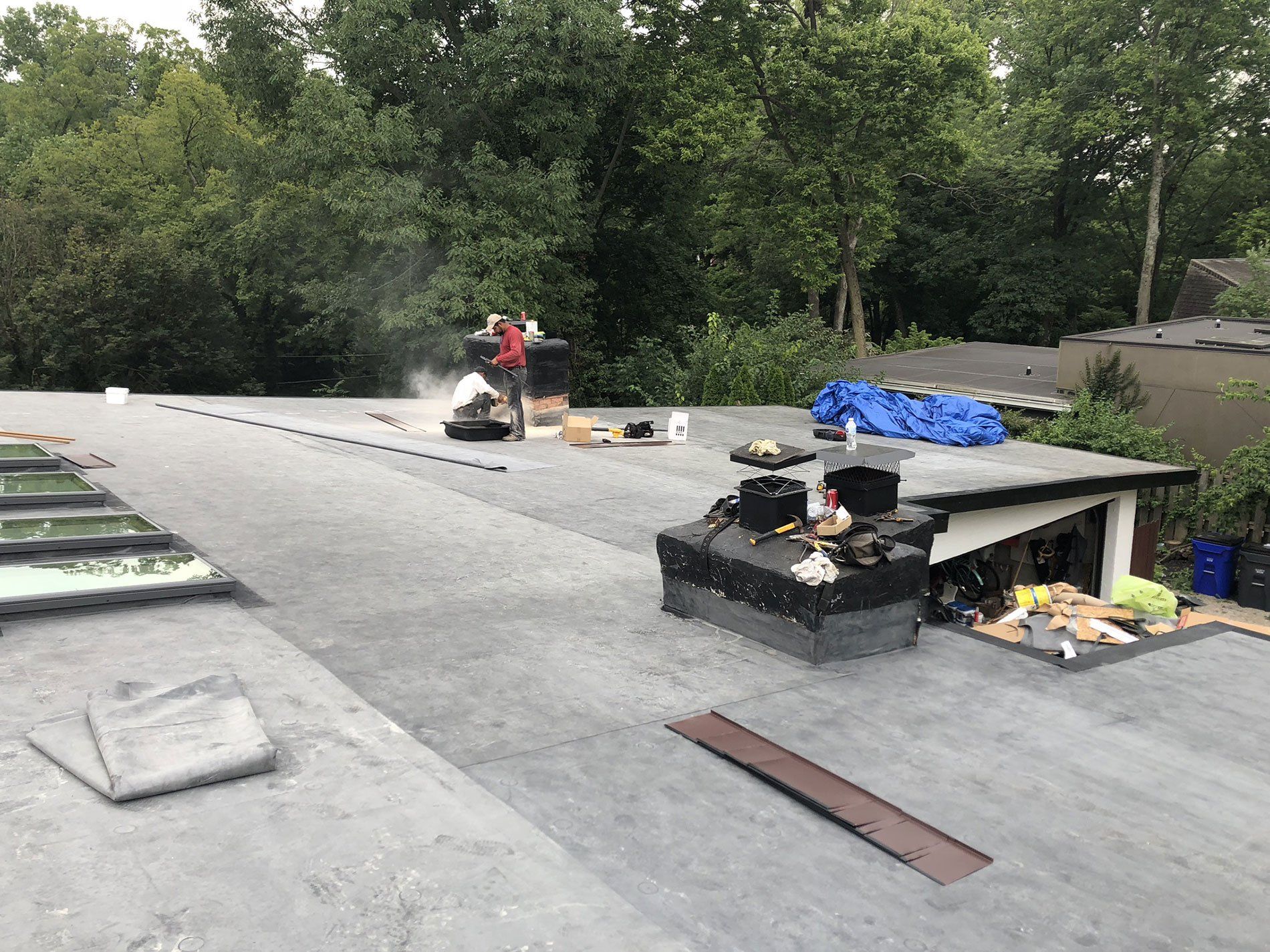 A flat roof is being installed on a house.