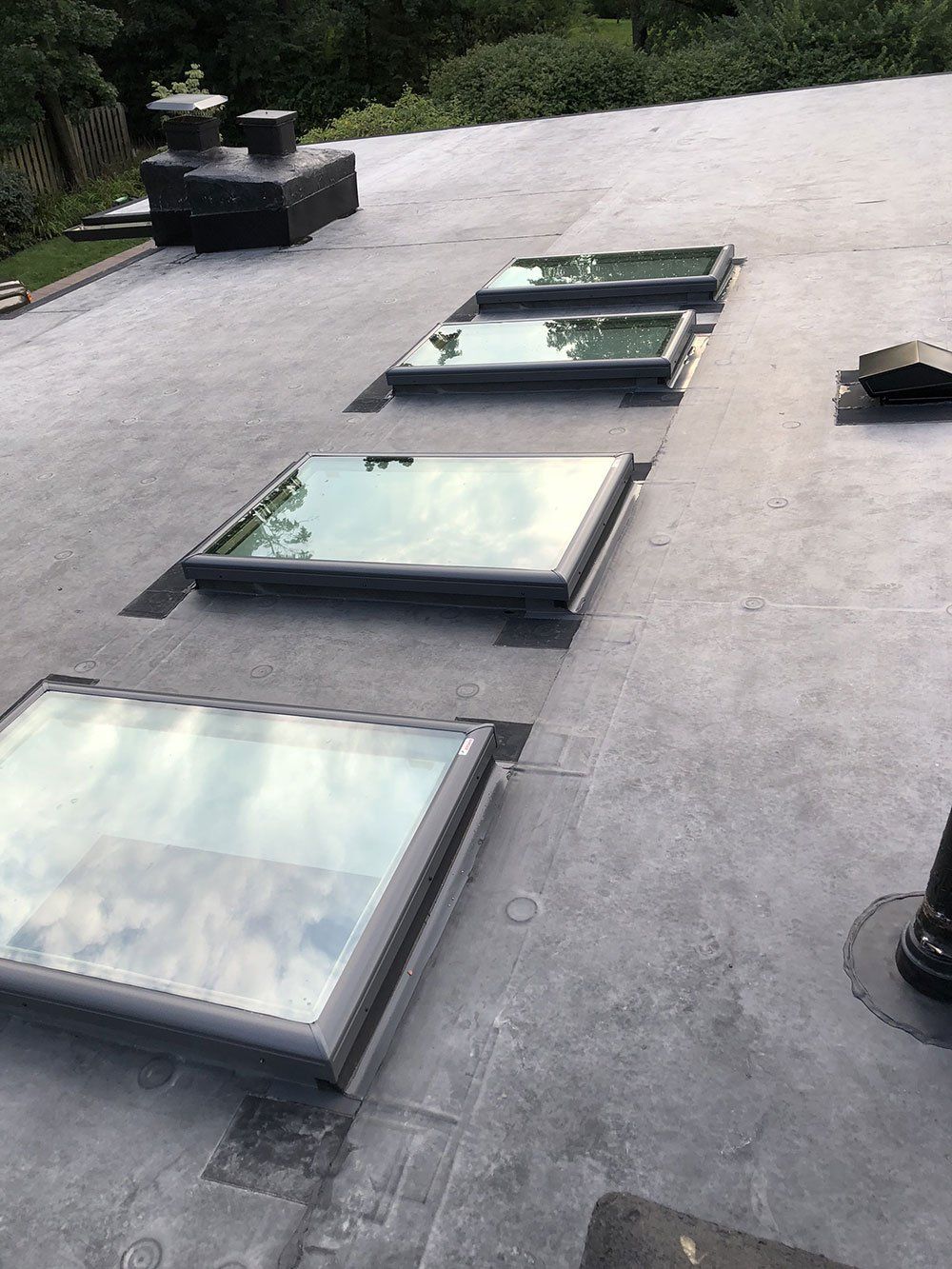 A row of skylights on the roof of a building.