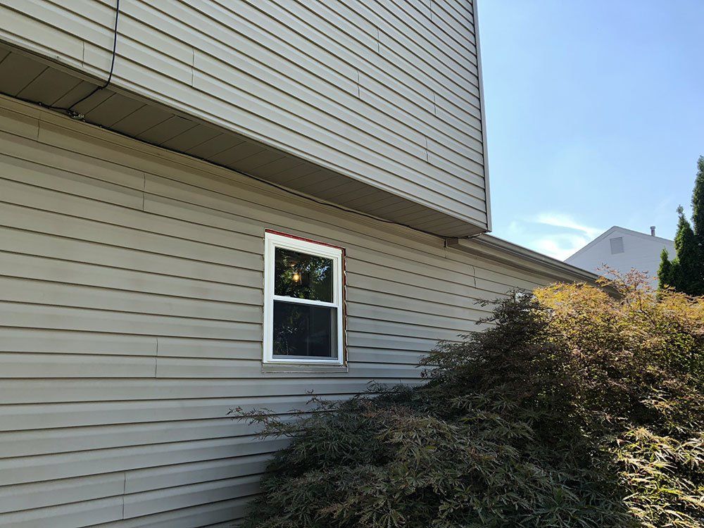 A house with a window on the side of it.