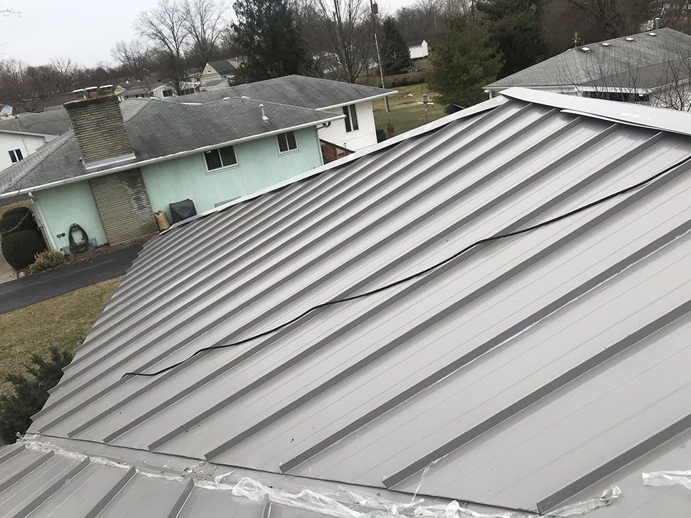 A close up of a metal roof on a house.