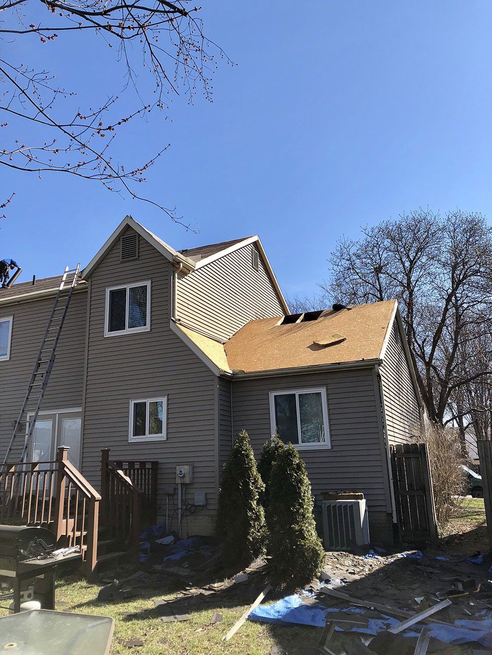 A house with a roof that is being repaired.