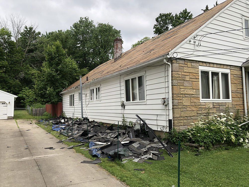 A house with a lot of shingles on the side of it.