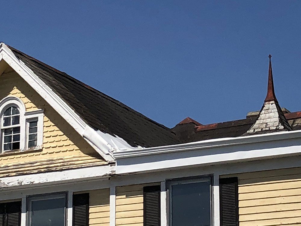 A house with a steeple on top of it