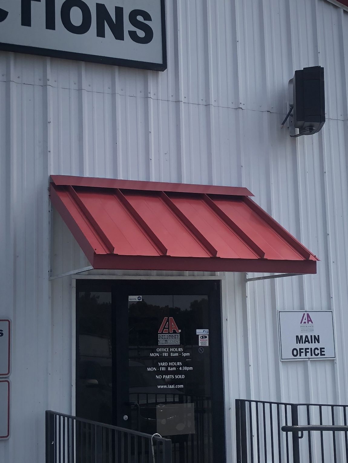 Foster Custom Designs — Simple Red Awnings Installed On A Door in Chalmette, LA