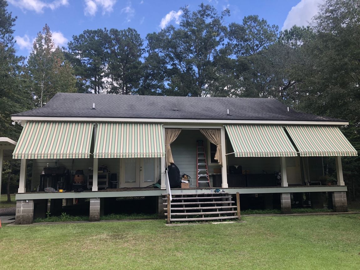 Retractable Custom Awnings — Retractable Awnings Installed Outside A House in Chalmette, LA