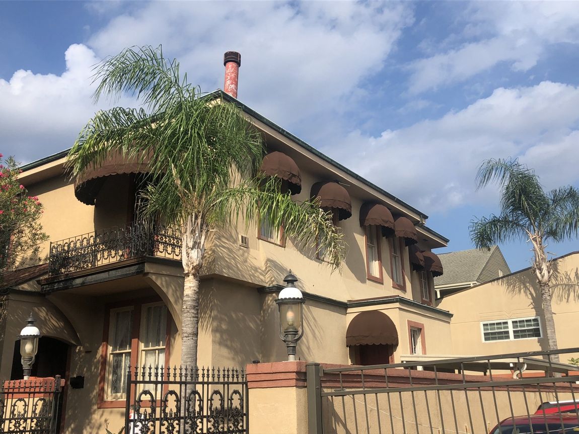 Oval & Gable Canopies — House With Oval Awnings In Windows And Doors in Chalmette, LA