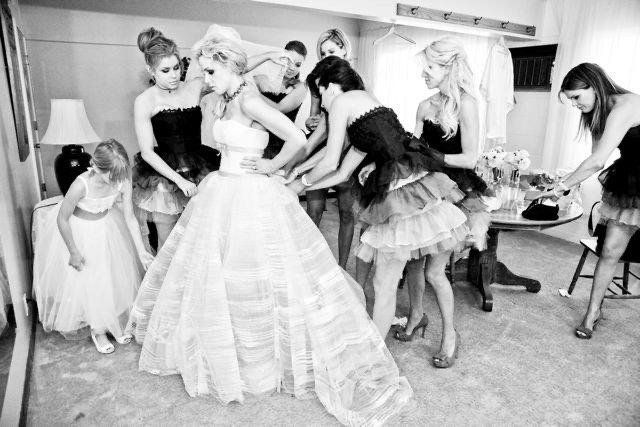 A black and white photo of a bride and her bridesmaids