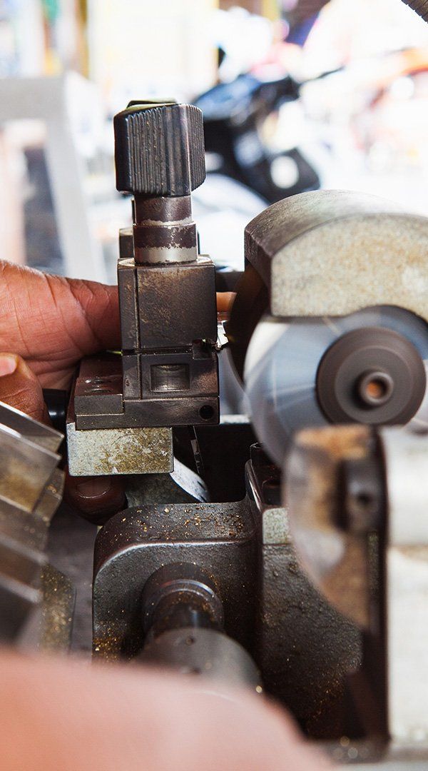 Locksmiths Making a New Key — Safe N Sound Locksmiths in Varsity Lakes, QLD