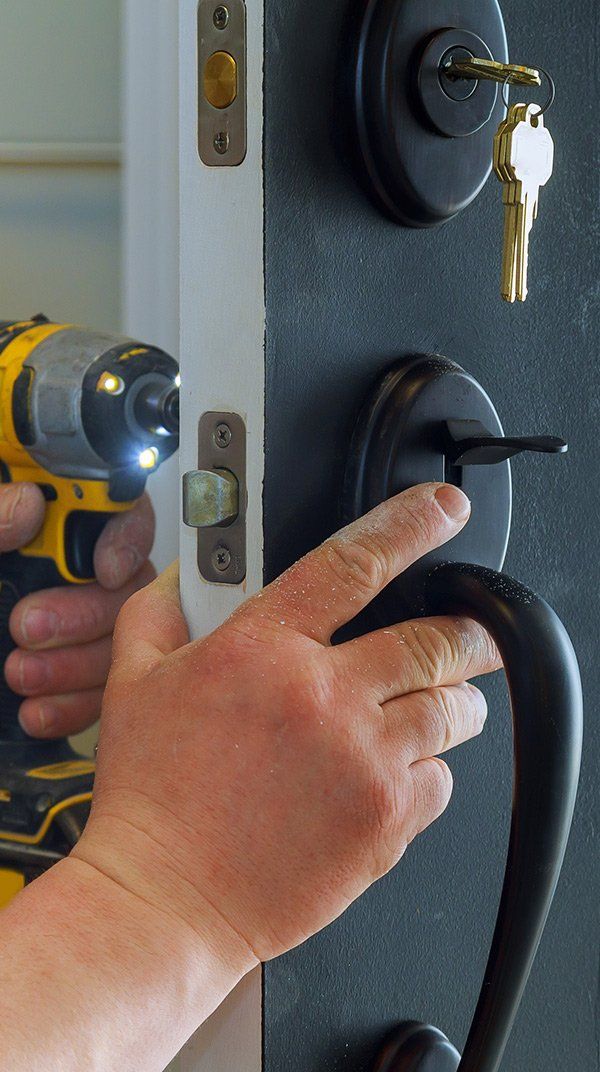 Locksmith Installing New Deadbolt Lock — Safe N Sound Locksmiths in Varsity Lakes, QLD