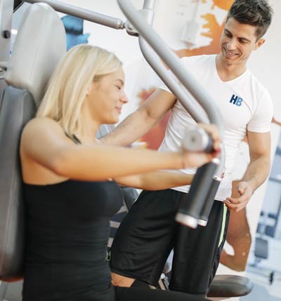 HomeBodies NYC Personal Trainer for Women Doing Weight Training