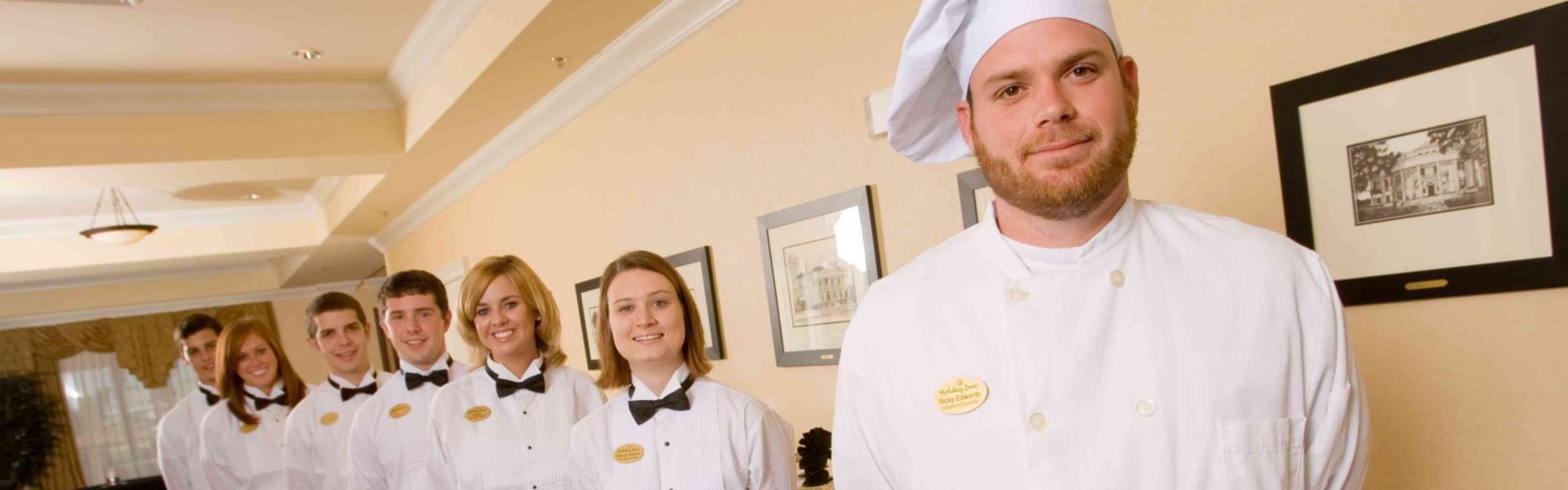 A chef with staff in white jackets at the Holiday Inn and Conference Center. A chef with staff at the Holiday Inn and Conference Center in Valdosta, GA.