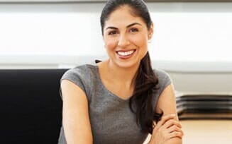 Smiling young woman in insurance company - Insurance in Kennett Square, PA Smiling young woman in insurance company - Insurance in Kennett Square, PA