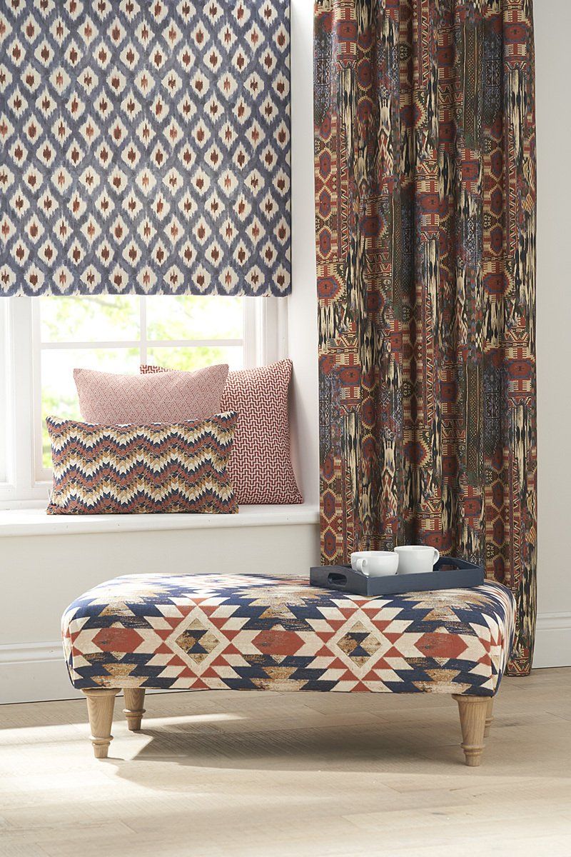 Totem-style patterned curtains in deep colours