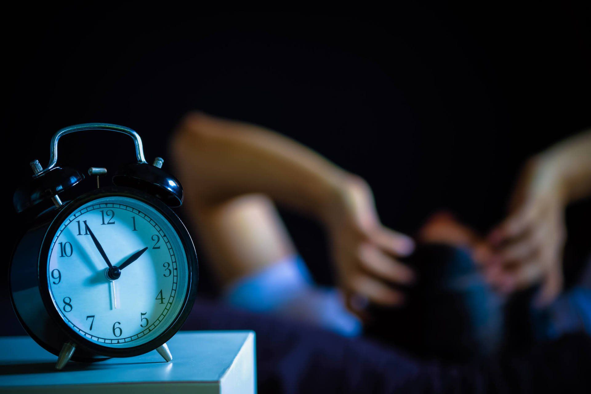 Alarm clock and person with insomnia