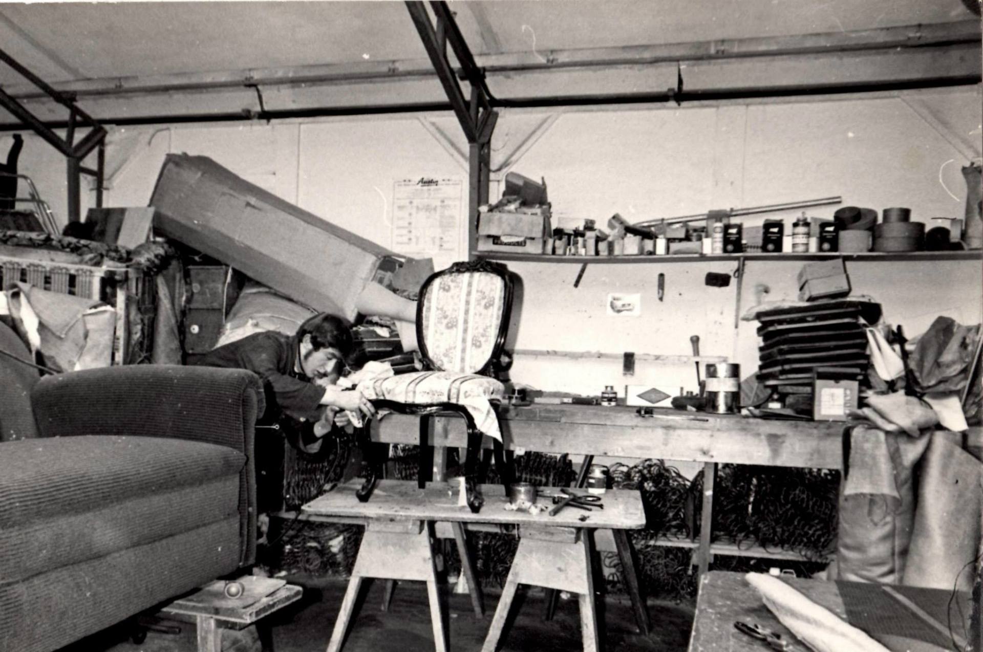Pete Feucht re-upholstering a chair