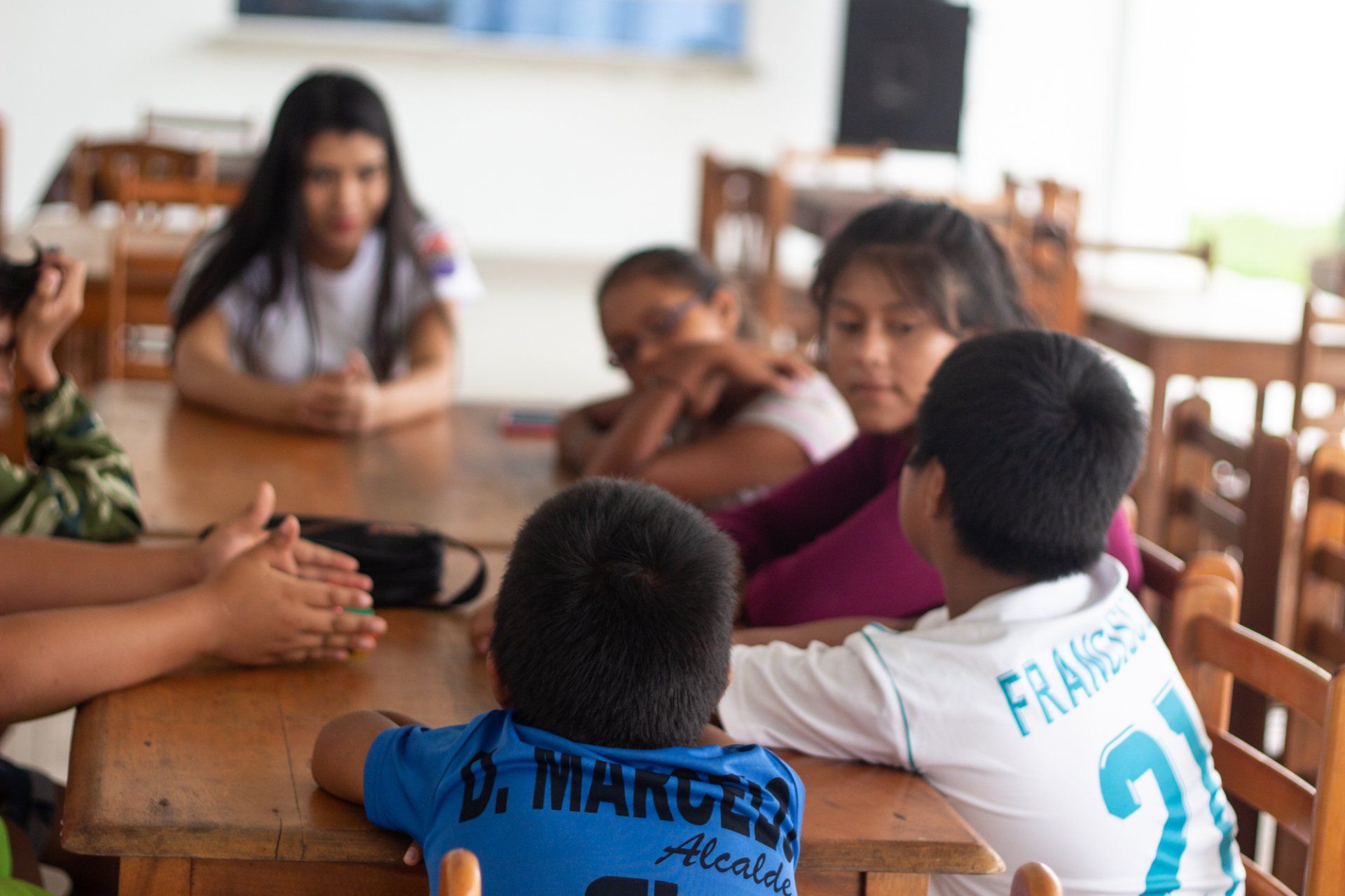 Children sat together talking