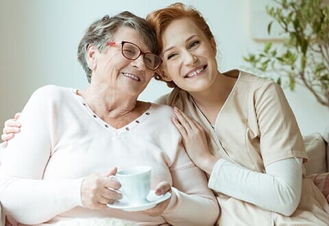 Nurse Smiling with Patient — Senior Care Giving in Prescott, AZ Nurse Smiling with Patient — Senior Care Giving in Prescott, AZ