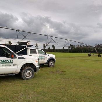 Service Trucks on Field — Stedman, NC — Horne Turf Farm Service Trucks on Field — Stedman, NC — Horne Turf Farm