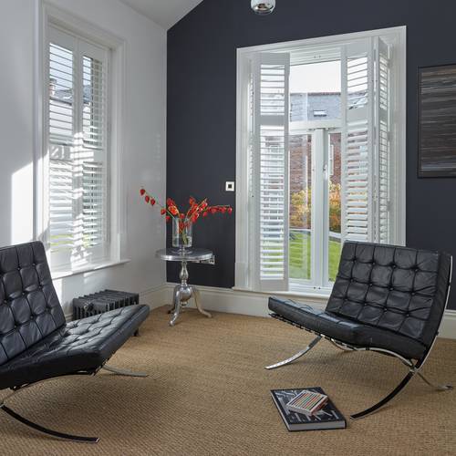 Full height bi-fold shutters with a divider rail