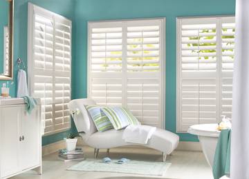 Tier on tier shutters with central tilt rod
