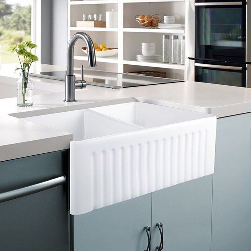 This Ceramic farmhouse sink from Bathroom sales direct sits proud out from the cabinets This Ceramic farmhouse sink from Bathroom sales direct sits proud out from the cabinets
