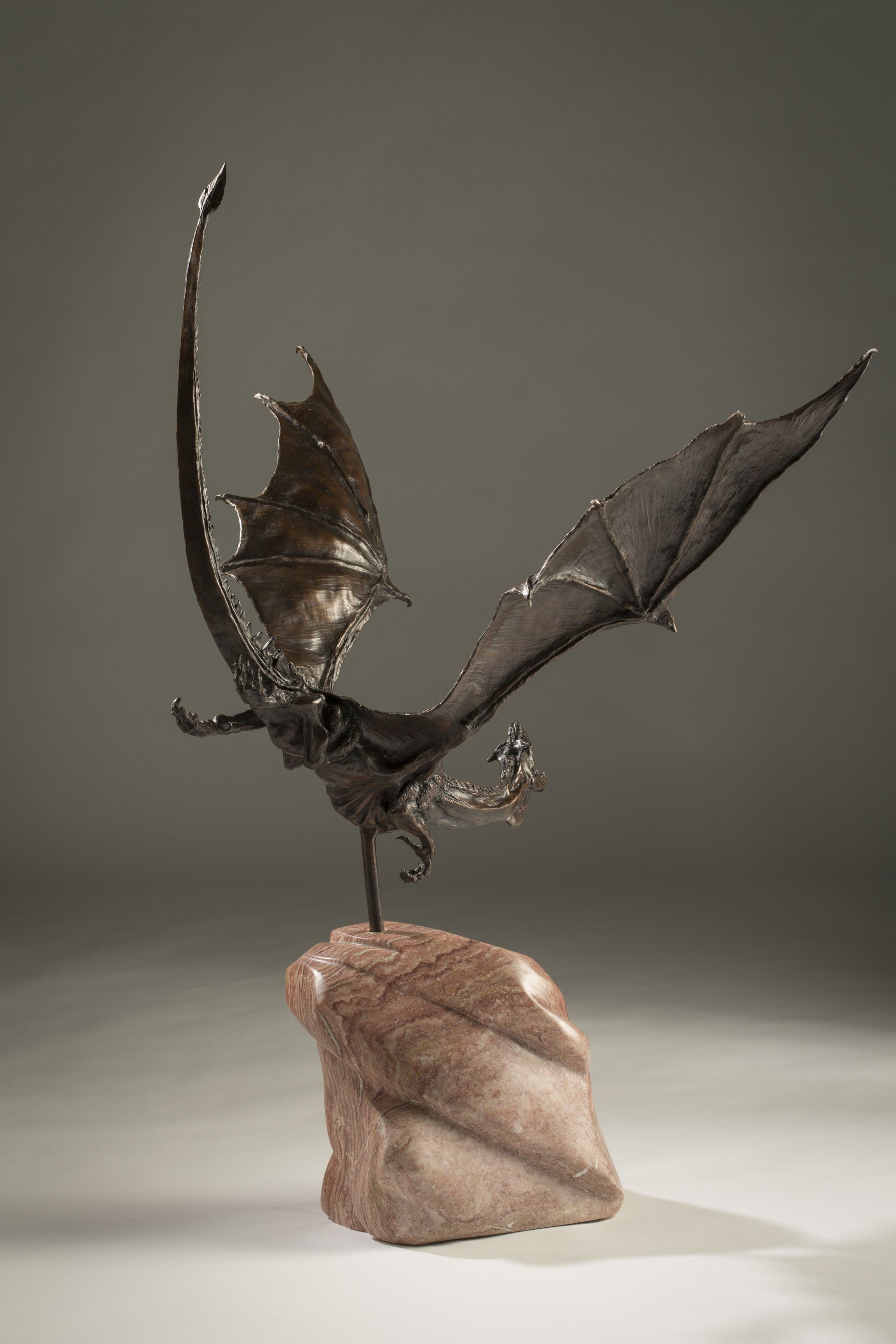 flying dragon sculpture in bronze bolt from the blue