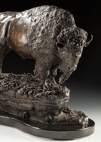 sculpture of veteran bull bison in bronze