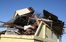 Scrap metals in yellow container — Metal Recycling in Cleveland, OH Scrap metals in yellow container — Metal Recycling in Cleveland, OH