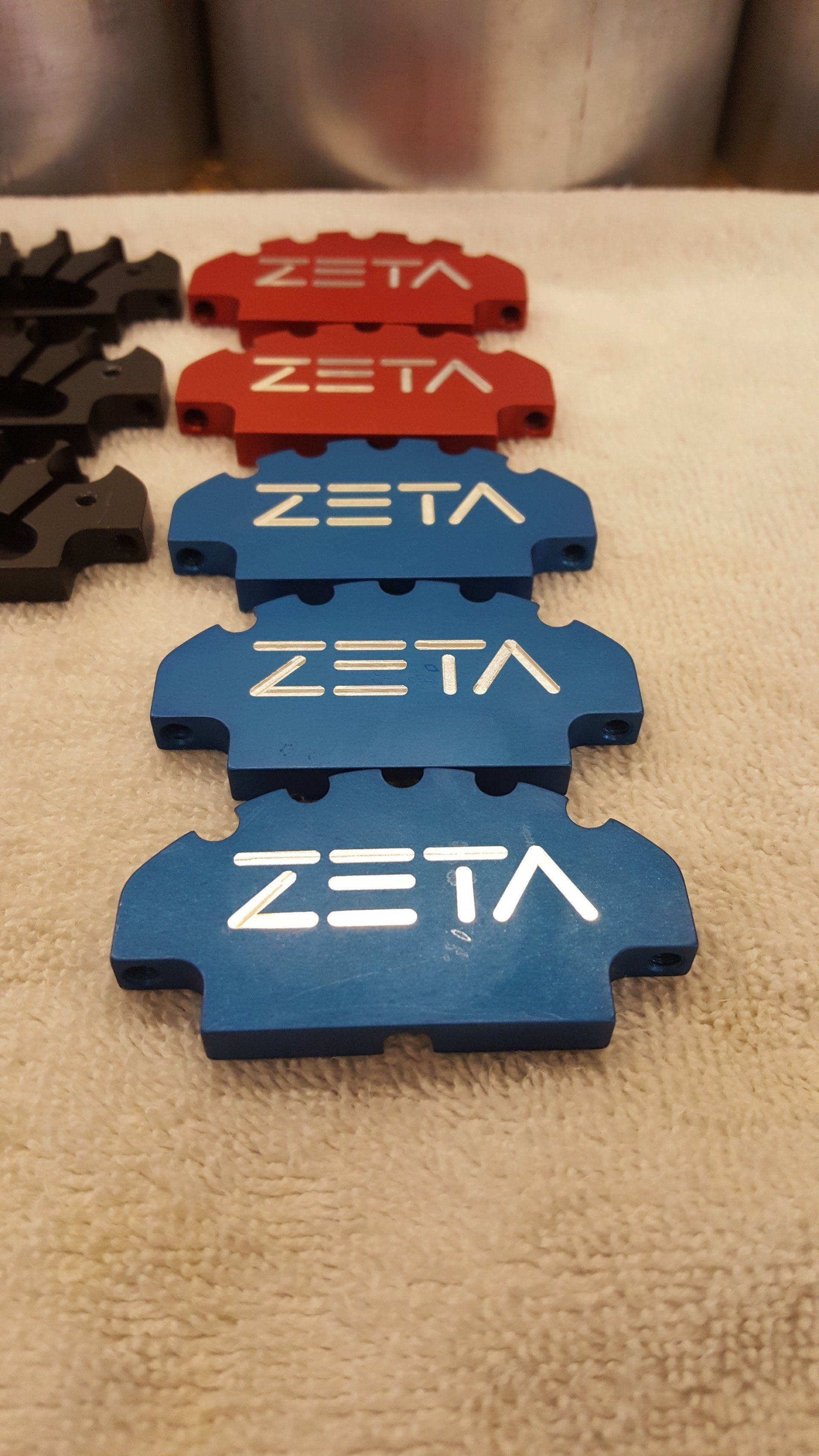 A row of brake pads with the word zeta on them