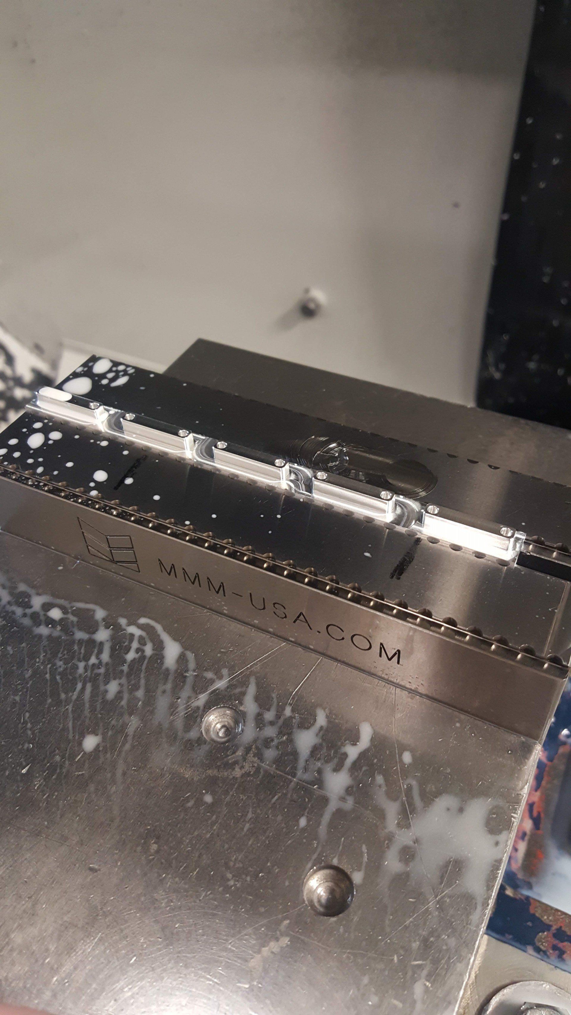 A close up of a piece of metal on a machine.
