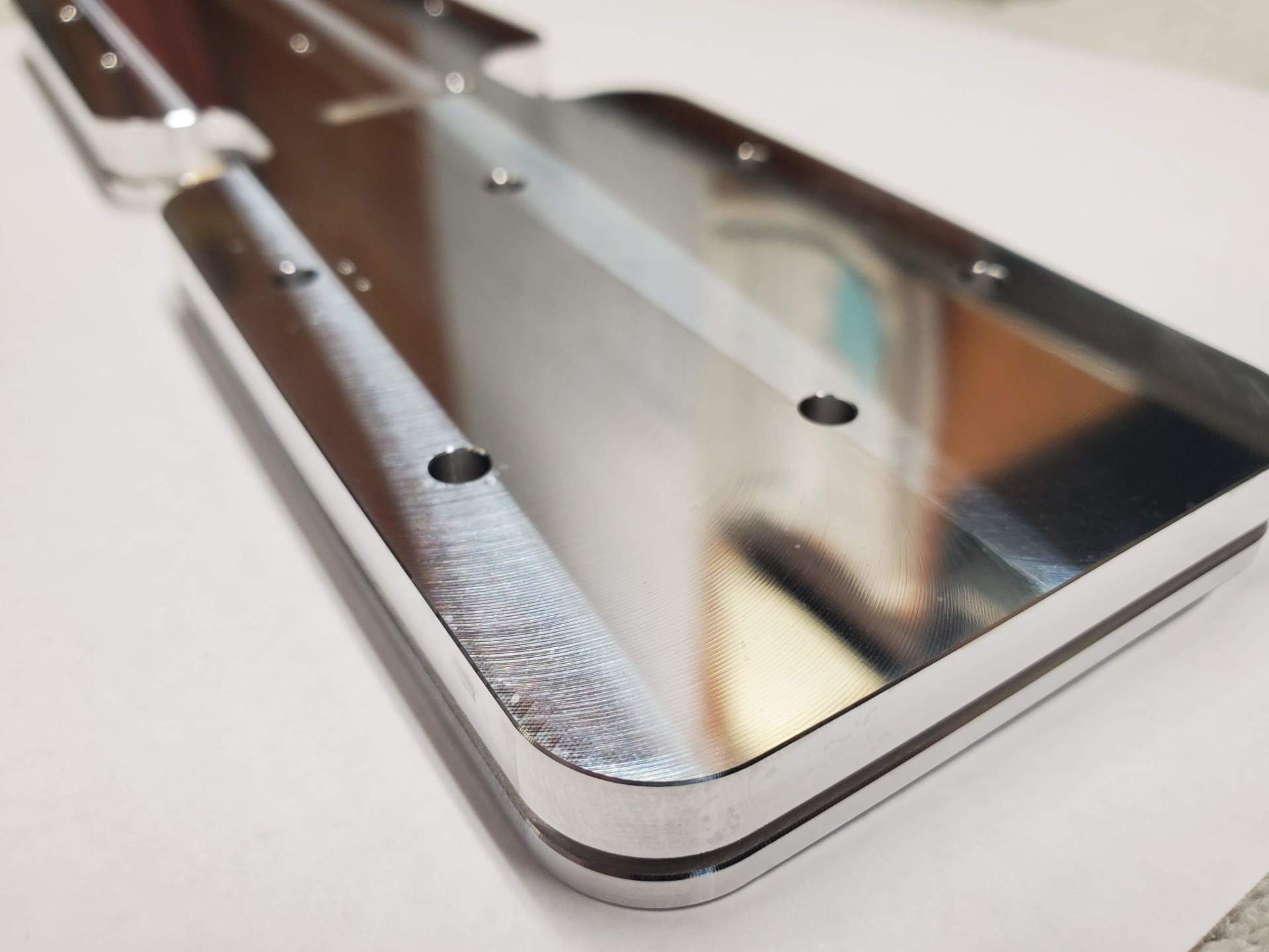 A close up of a piece of metal with holes in it