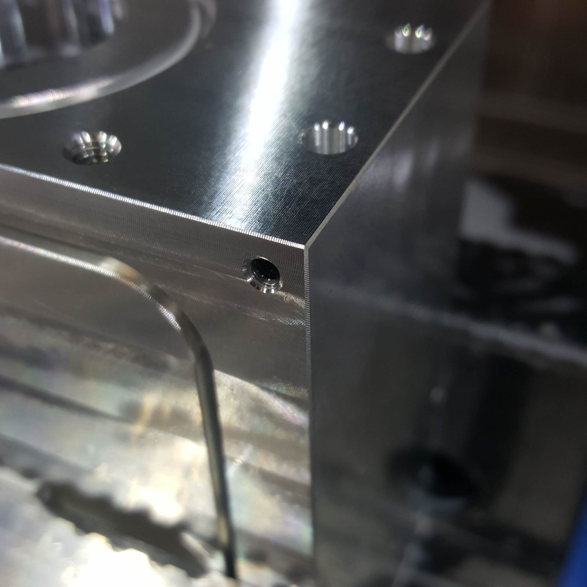 A close up of a metal block with holes in it